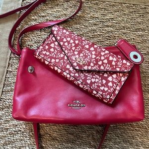 Red Coach cross body purse with matching clutch.